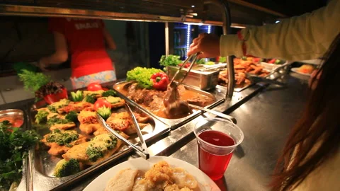Various Ready-made Meals on the Counter in Dining Room Self-service. People with Stock Footage 109289101