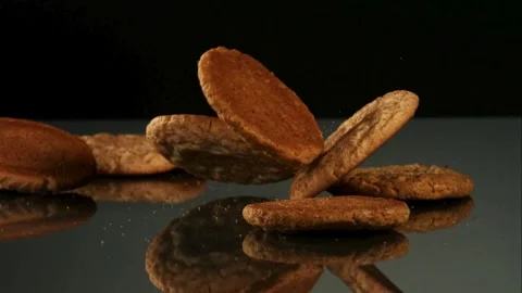 Various round cookies falling on a table Video stock 327052100
