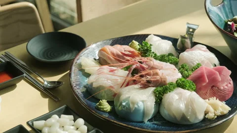 Various sashimi placed on a wooden table. Stock Footage 149857001