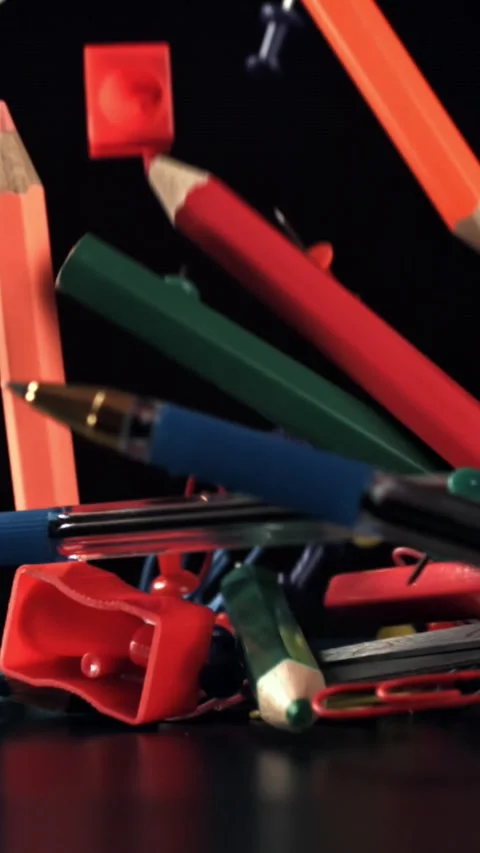 Various school tools fall on the table. Filmed on a high-speed camera at 1000 Stock Footage 335373701