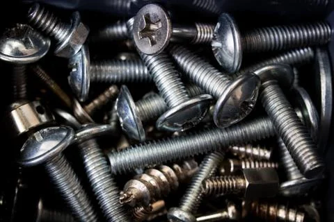 Various screws close up, background or texture Stock Photos