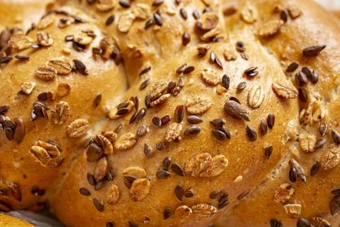 Various seeds on fresh bread texture, soft focus close up Stock Photos