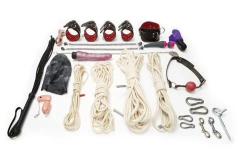 Various set of handcuffs, ropes, vibrators and other sexual toys for BDSM Stock Photos