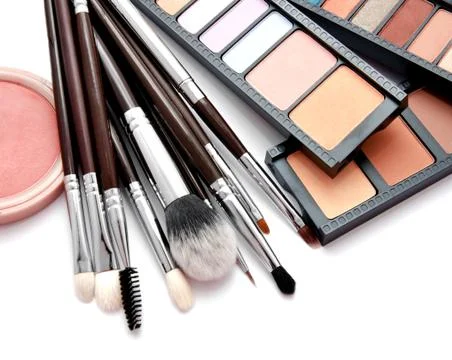 Various set of professional makeup brushes and palette of colourful eye shado Stock Photos