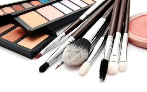 Various set of professional makeup brushes and palette of colourful eye shado Stock Photos