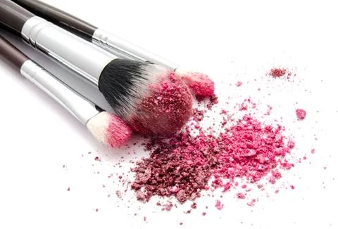 Various set of professional makeup brushes and colourful eye shadows isolated Stock Photos