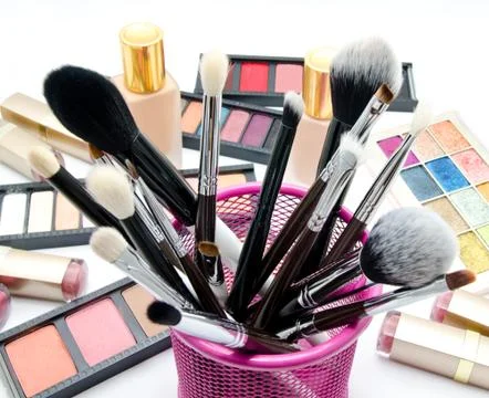 Various set of professional makeup brushes and cosmetics and palette of colou Stock Photos