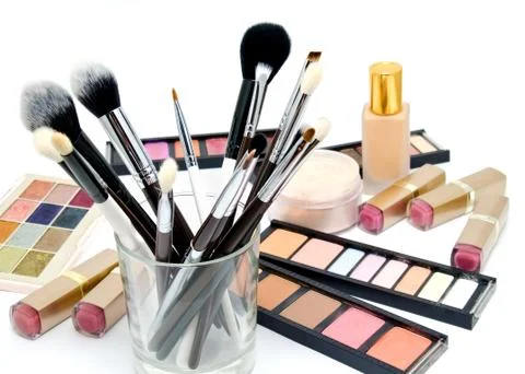 Various set of professional makeup brushes and cosmetics and palette of colou Stock Photos
