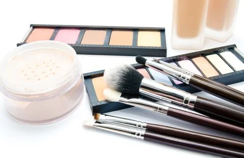 Various set of professional makeup brushes and cosmetics and palette of colou Stock Photos