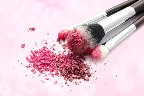 Various set of professional makeup brushes and colourful eye shadows isolated Stock Photos