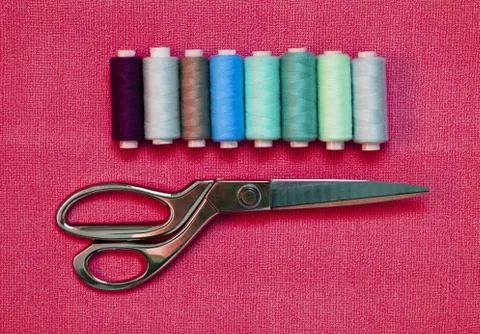 Various Sewing Accessories: colored threads, scissors Stock Photos