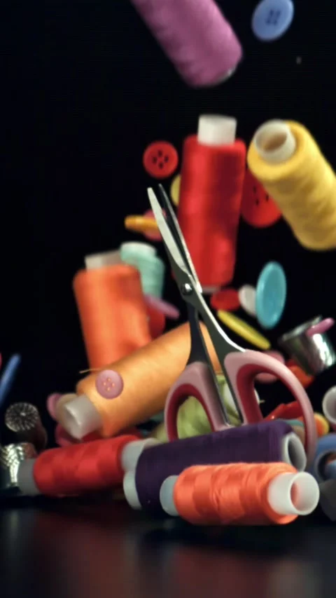 Various sewing tools fall on the table. Filmed on a high-speed camera at 1000 Stock Footage 335368556