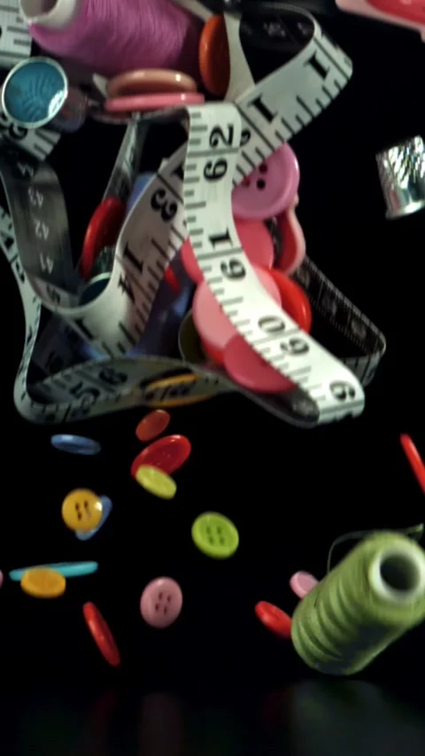 Various sewing tools fall on the table. Filmed on a high-speed camera at 1000 Stock Footage 335373250