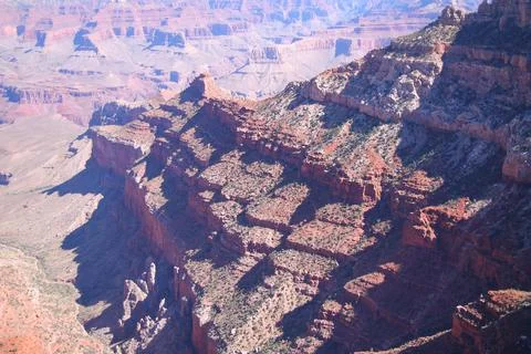 The various shades of red generated by the sun on the red rocks of the Grand  Stock Photos
