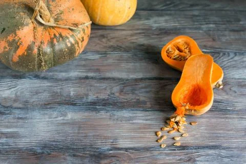 Various shaped pumpkins on the wooden rustic table Stock Photos