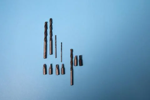 Various shapes and sizes of drill parts and bits Stock Photos
