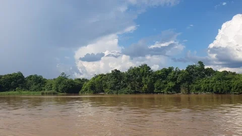 Various shapes of white clouds in the blue sky and river water 스톡 동영상 337518390