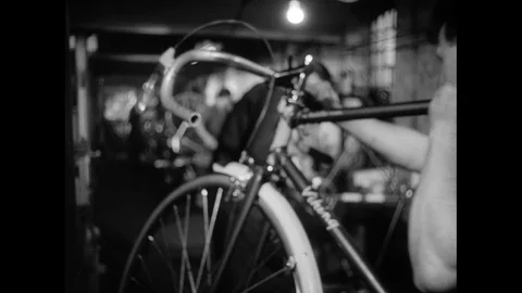 Various shots of bicycle assembly and fine tuning of components, UK 1959 Stock Footage 133384013