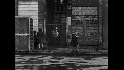 Various shots of children playing without parents, UK 1944 Stock Footage 139238396