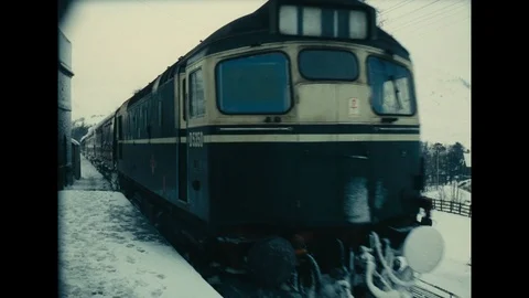 Various shots of train station covered in snow, UK 1963 Stock Footage 133281570