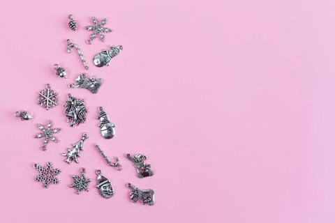 Various silver Christmas tree decorations on pink background with text space  스톡 사진