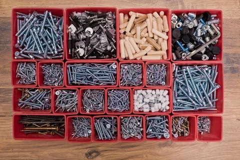 Various size and shape of screws, bolts, wooden pegs selection. Stock Photos