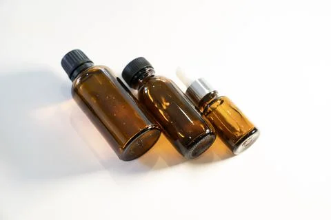 Various sizes of amber glass bottles Stock Photos