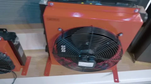 Various sizes of car radiators complete with fans are presented at exhibition Stock-Footage 333326096