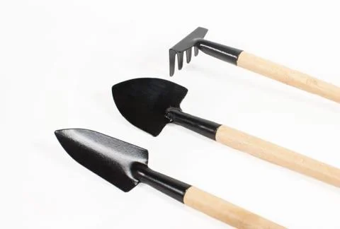 Various small gardening tools close-up on a white background Stock Photos