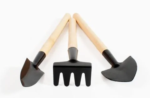 Various small gardening tools close-up on a white background Stock Photos