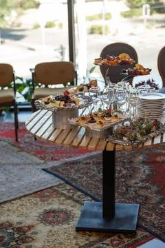 Various snacks and drinks on the table at the event Stock Photos