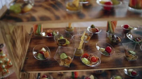 Various snacks on a buffet table at the event, the camera moves smoothly. Stock Footage 66557784