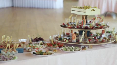 Various snacks on a table event, the camera on the move goes around the table Video stock 66557926