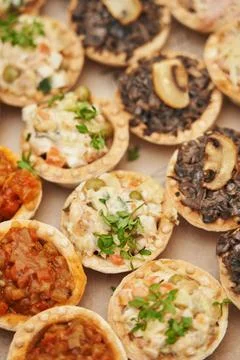 Various snacks in tartlets close-up Stock Photos