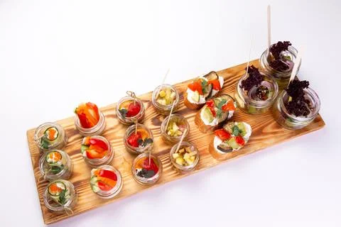 Various snacks on a tray white background. Stock Photos