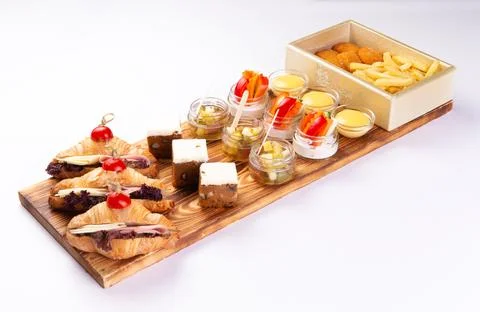 Various snacks on a tray white background. Stock Photos