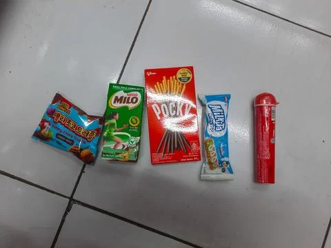 Various Snacks on the White Ceramic Floor Foto stock
