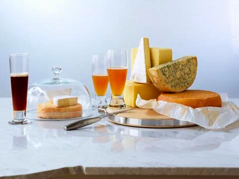 Various sort cheeses with beer Stock Photos