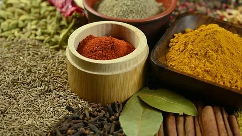 Various spices are scattered on the table Stock Footage 121115111