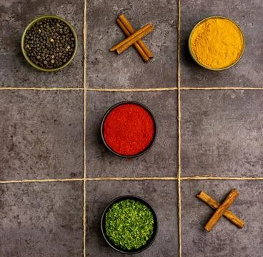 Various spices (red pepper powder, turmeric powder, black pepper, dried par.. Stock Photos