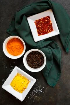 Various spices on slate background Stock Photos