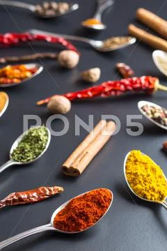 Various spices in spoons. Stock Photos