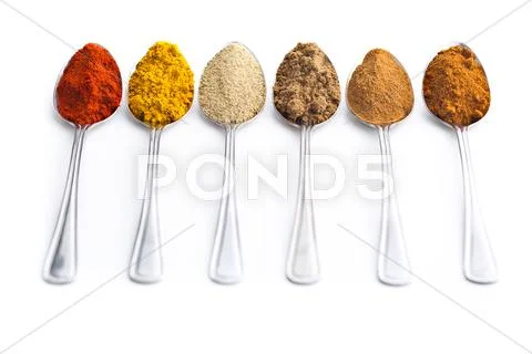 Various spices in spoons. Stock Photos