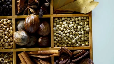 Various spices in wooden box with different small compartments Video stock 333810207