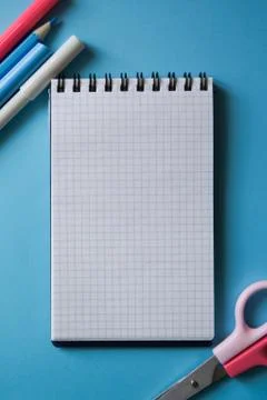 Various stationery and notebook on a two-color background. Stock Photos