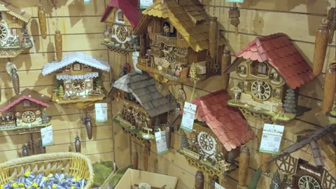 Various styles and sizes of Cuckoo clocks for sale. Stock Footage 289558940