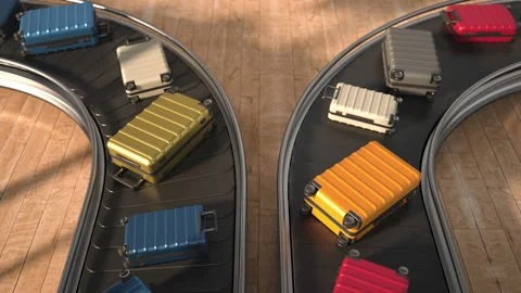 Various suitcases moving along the baggage conveyor belt in the arrival area of  Stock Footage 221195601