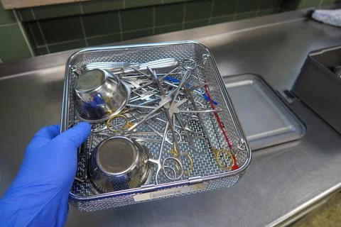 Various surgical instruments are located in an instrument basket Stock Photos