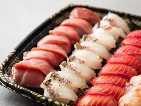 Various sushi on a plate for packaging Stock Photos