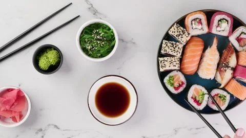 Various sushi rolls are served on a plate on a white stone background Stock-Footage 150508886